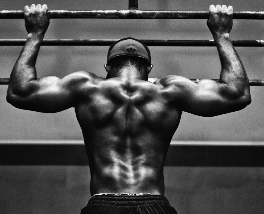 grayscale photo of man working out